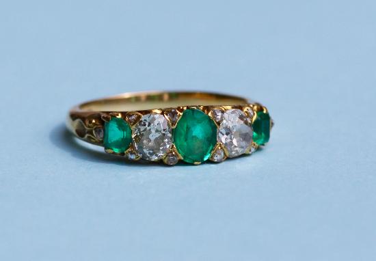 ANTIQUE EMERALD AND DIAMOND FIVE STONE ENGAGEMENT RING