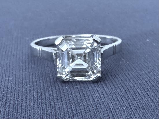 ASSCHER CUT DIAMOND RING.