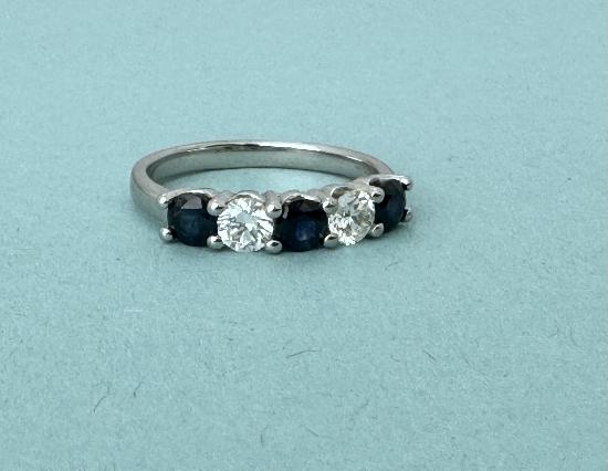 PLATINUM SAPPHIRE AND DIAMOND RING.